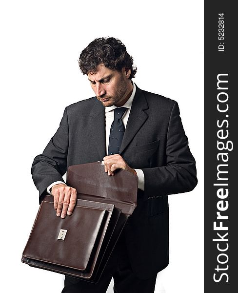 Businessman searching for some paper in the suitcase. Businessman searching for some paper in the suitcase