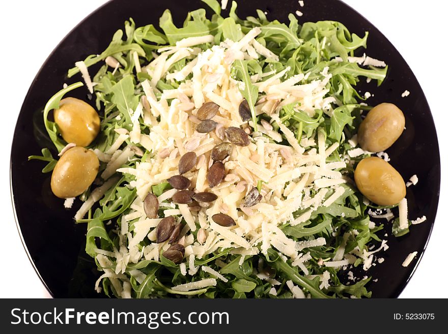 Rucola salad with Olives parmesan and pumpkin seeds.