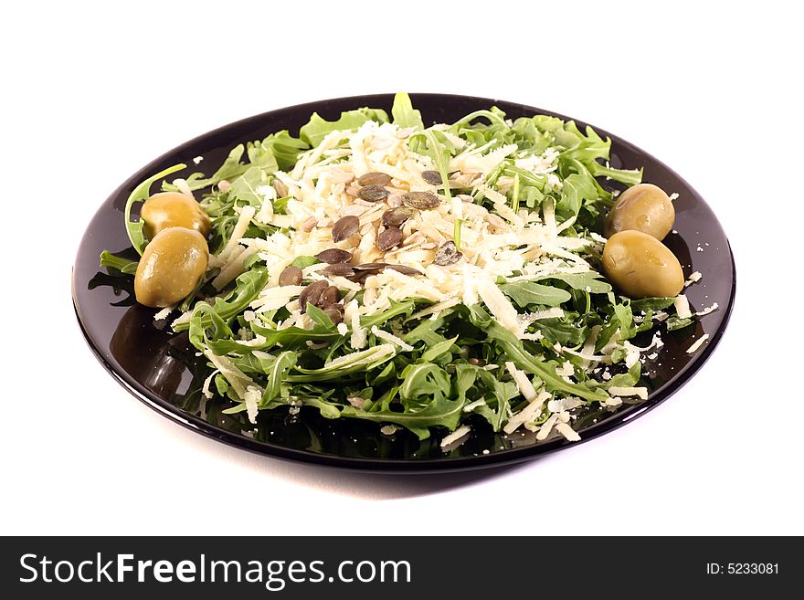 Rucola salad with Olives parmesan and pumpkin seeds.