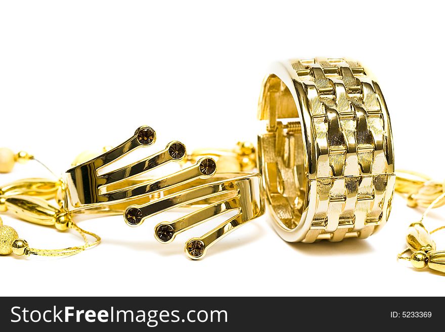 Golden bracelets with beads isolated on white background