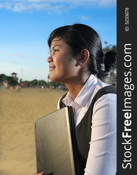 Business woman at beach with laptop. Business woman at beach with laptop