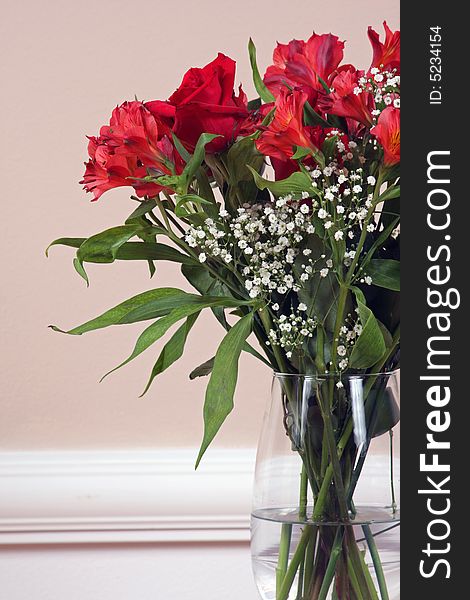 Roses and Alstroemeria in a crystal vase. Roses and Alstroemeria in a crystal vase.