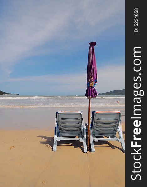 Empty beach chairs facing the open sea. Empty beach chairs facing the open sea