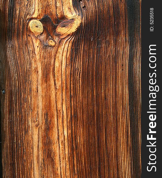 A wooden texture with a face like pattern. A wooden texture with a face like pattern
