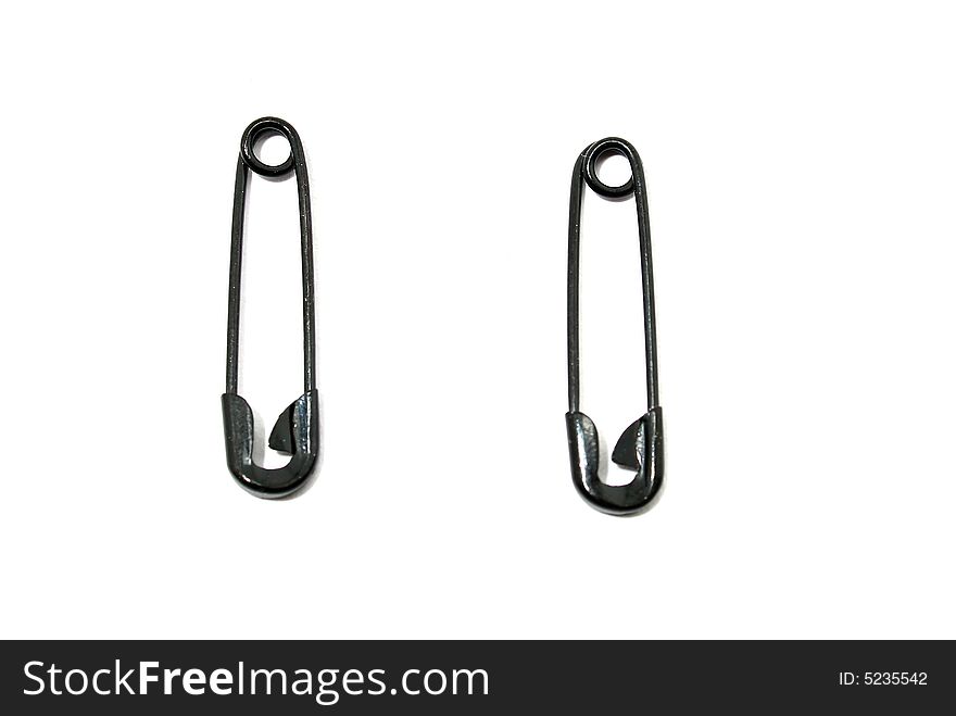 Safety pins isolated on white background