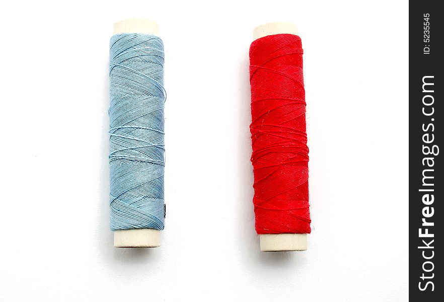 Two spools of thread isolated