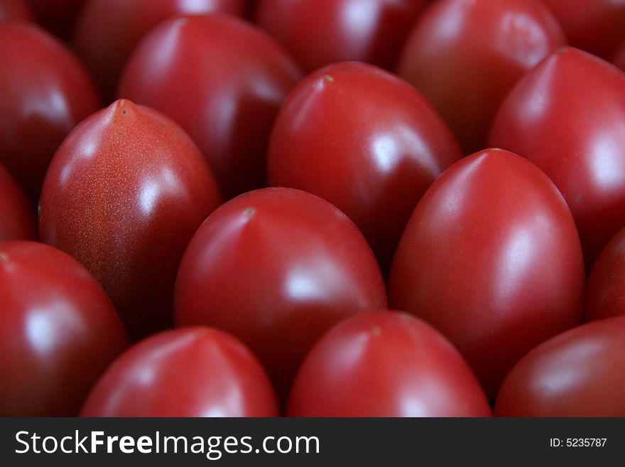 A close-up shot of a bunch of tomatoes.