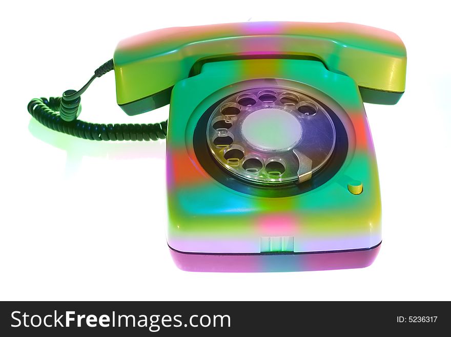 Old colorful telephone on white background