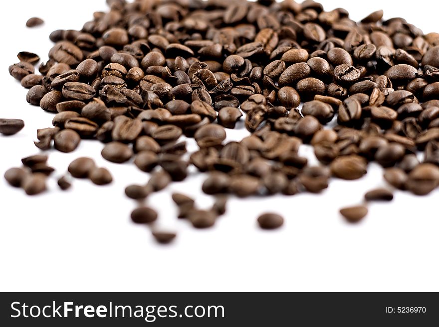 Coffee beans isolated on white background, shallow depth of field. Coffee beans isolated on white background, shallow depth of field