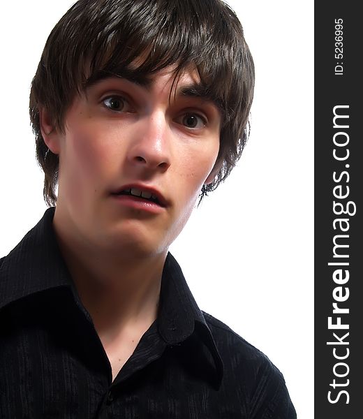 A portrait about a trendy attractive young guy who is looking towards and he is surprised. He is wearing a stylish black shirt. A portrait about a trendy attractive young guy who is looking towards and he is surprised. He is wearing a stylish black shirt.