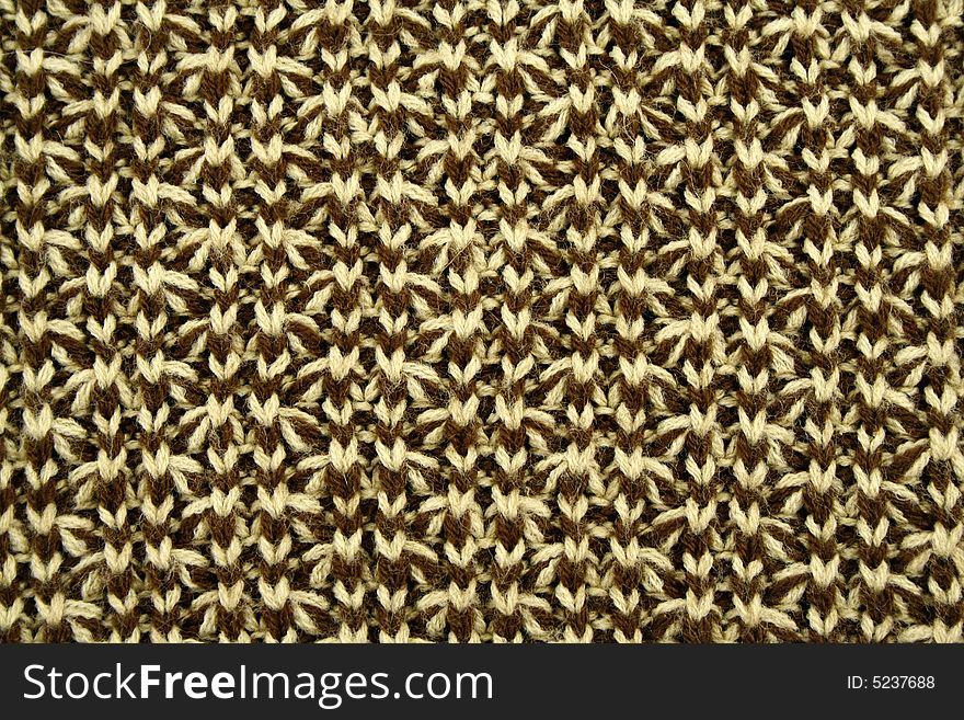 Texture of knitted green and beige cloth. Texture of knitted green and beige cloth