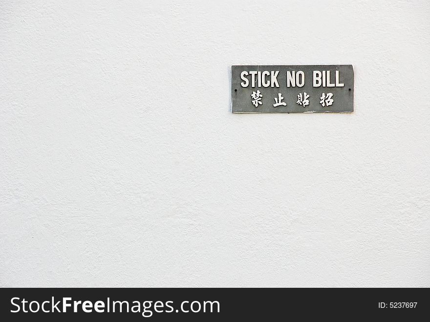 Sign on a white wall. Sign on a white wall