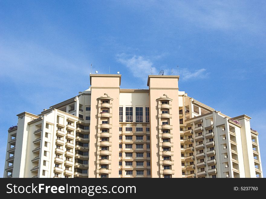 Apartment building with a bright blue sky