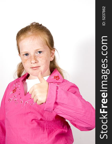 Cute little girl with thumb up