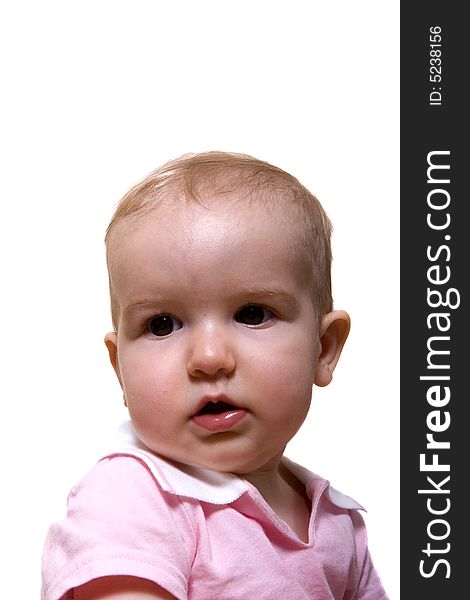 A young baby in pink on a white background. A young baby in pink on a white background