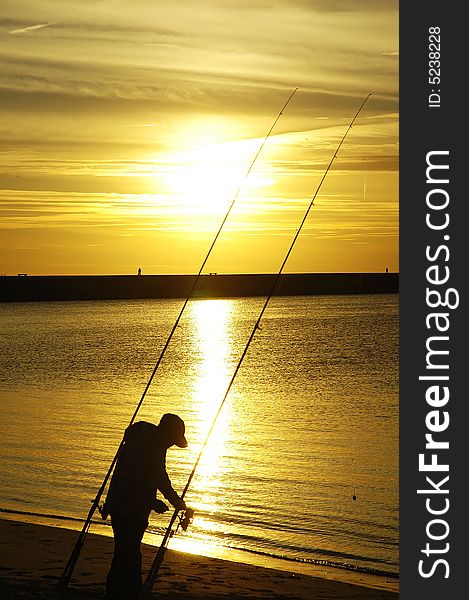 Fisherman At Beach Sunset