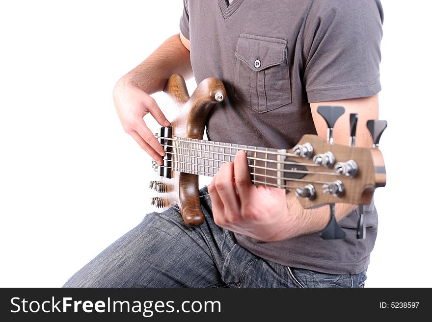 Detail of a man playing bass - focus on man's right hand