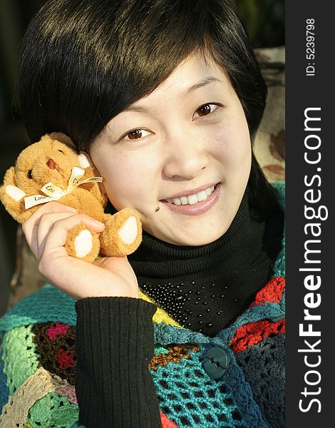 One smile chinese women with bear. One smile chinese women with bear