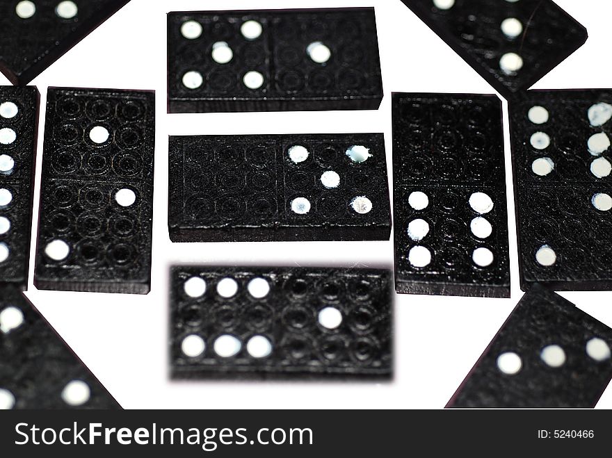 A photograph of a variety of different numbers of spots on dominoes blocks. A photograph of a variety of different numbers of spots on dominoes blocks