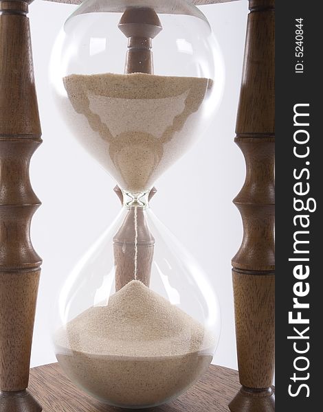 Wooden hourglass on white background. Wooden hourglass on white background