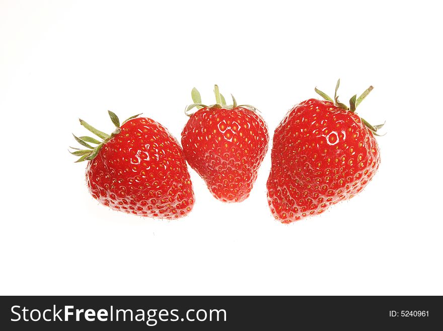 Three strawberries isolated on a white background. Three strawberries isolated on a white background