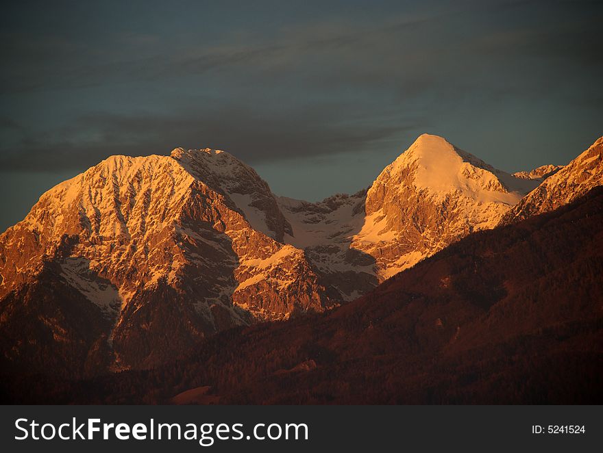 Sun setting on the snowy slopes of Grintovci Alps. Sun setting on the snowy slopes of Grintovci Alps