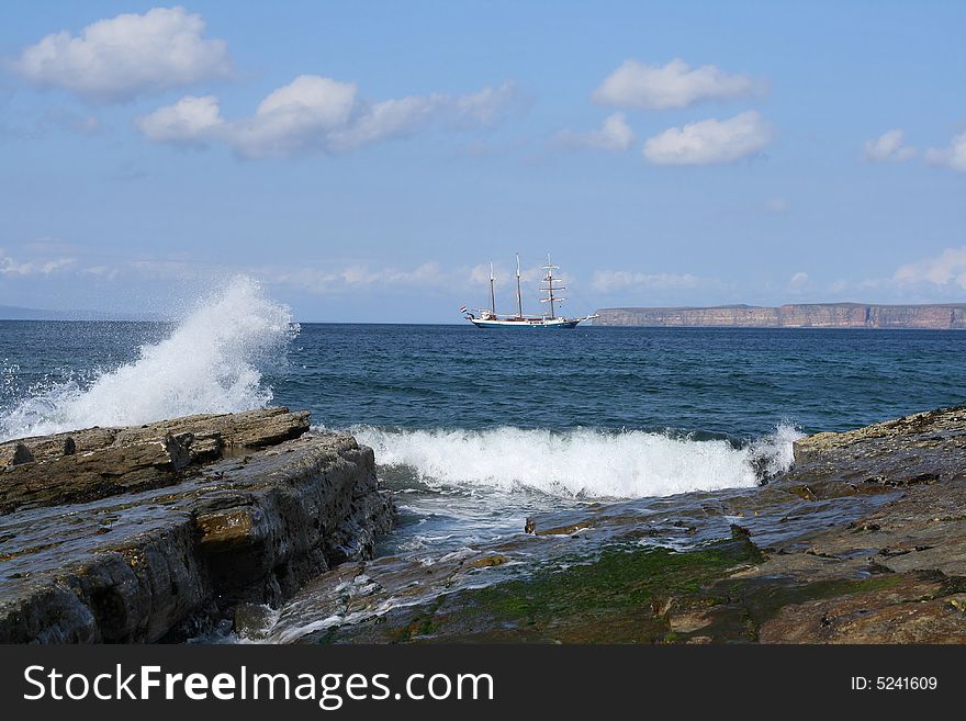 Three masted schooner at anchor in the bay.