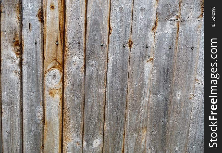 A close up image of a wooden fence, it would make a good texture background. A close up image of a wooden fence, it would make a good texture background.