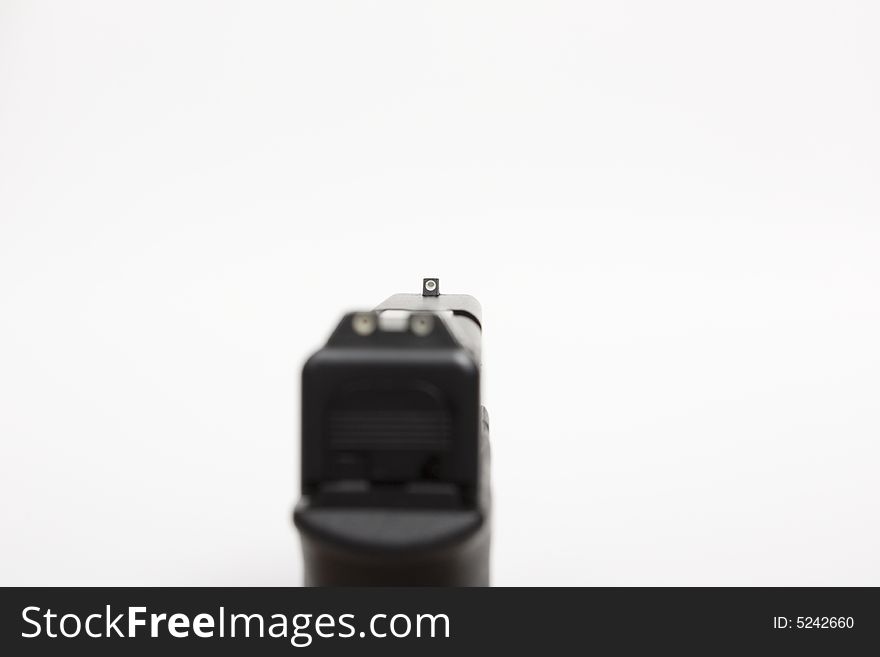 Looking down the front sight of handgun, with shallow DOF. Looking down the front sight of handgun, with shallow DOF