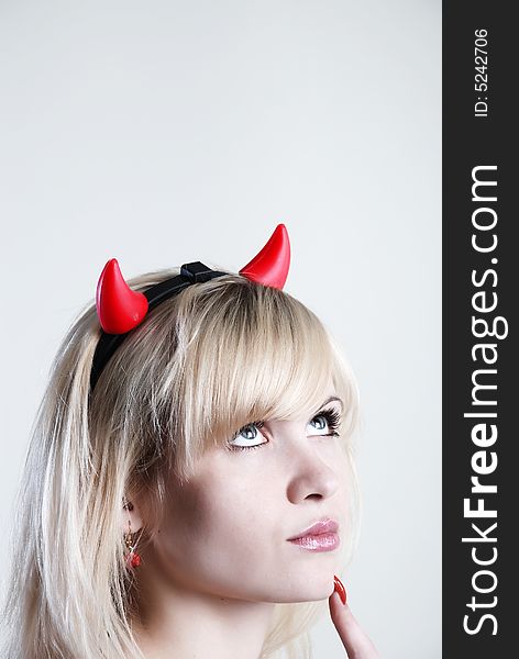 Beauty woman devil thinking at white background