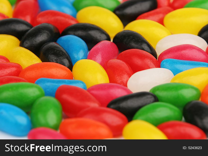 Many different coloured jellybean sweets. Many different coloured jellybean sweets