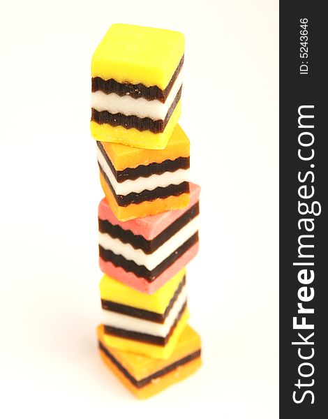 Isolated Licorice pieces stacked on top of each other