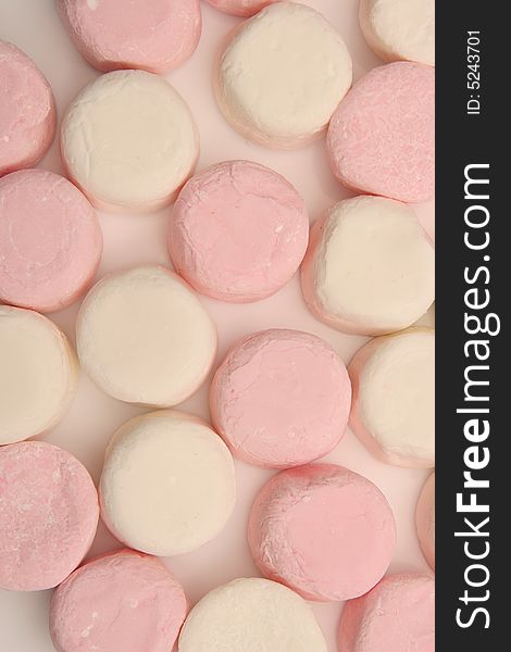 Pink and white marshmellows next to eachother. Pink and white marshmellows next to eachother