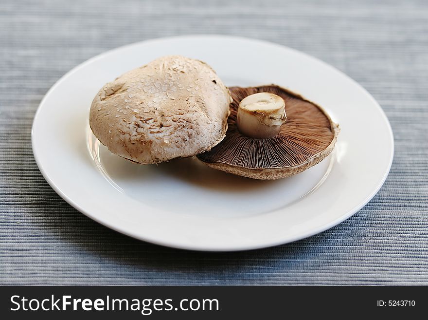 Fresh mushrooms on a white plate