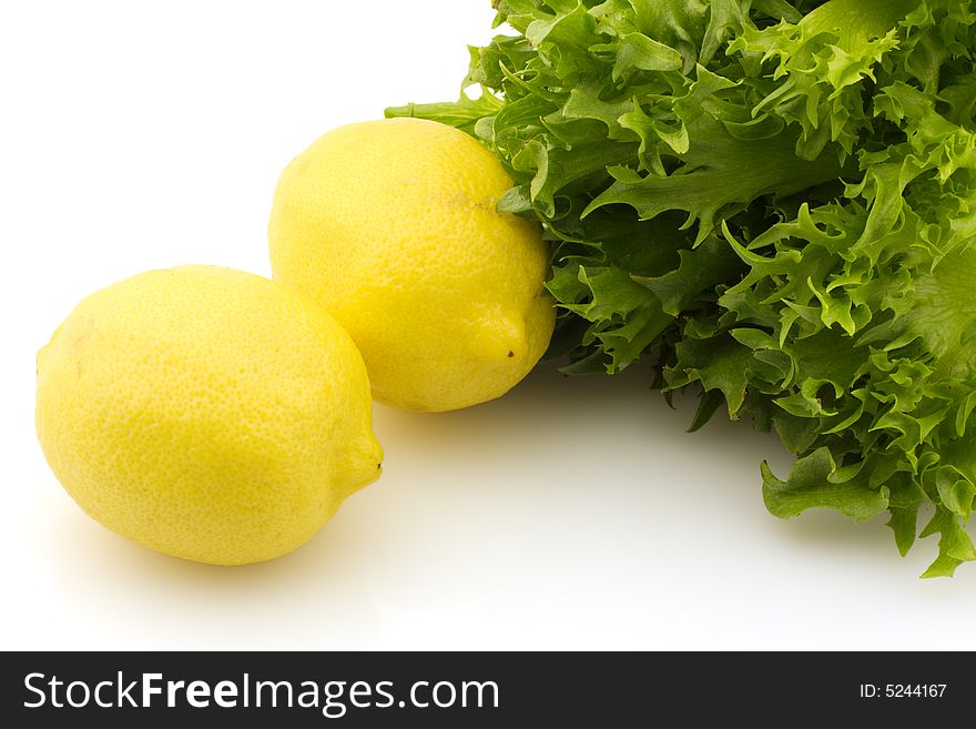 Two lemons and lettuce, isolated on white background. Two lemons and lettuce, isolated on white background