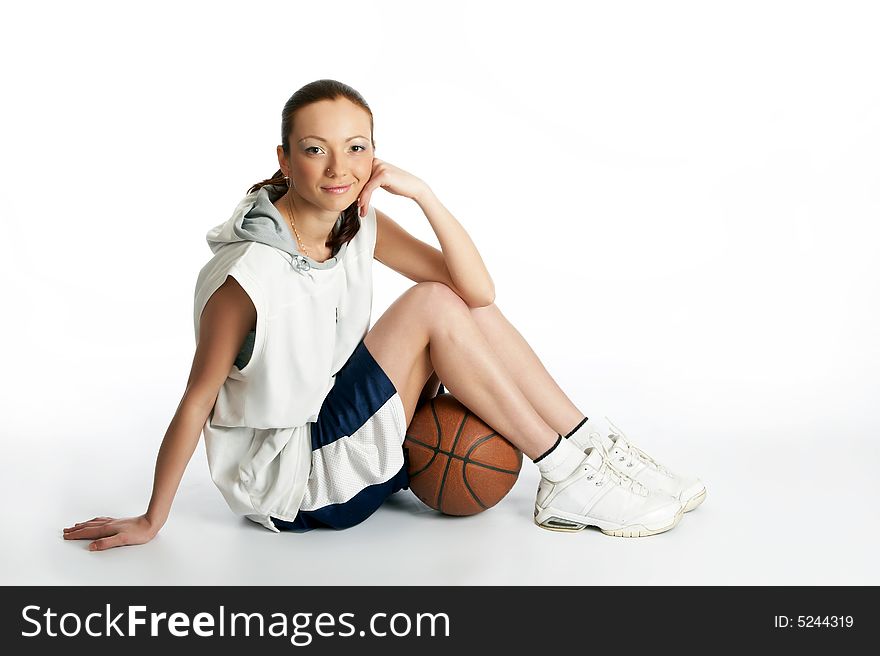 Young beautiful female basket ball player