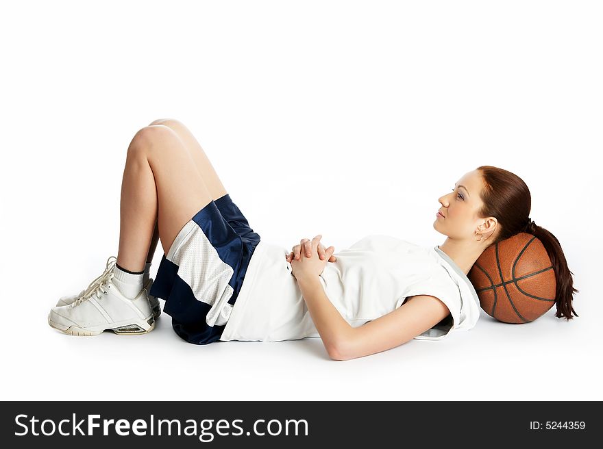 Young beautiful female basket ball player