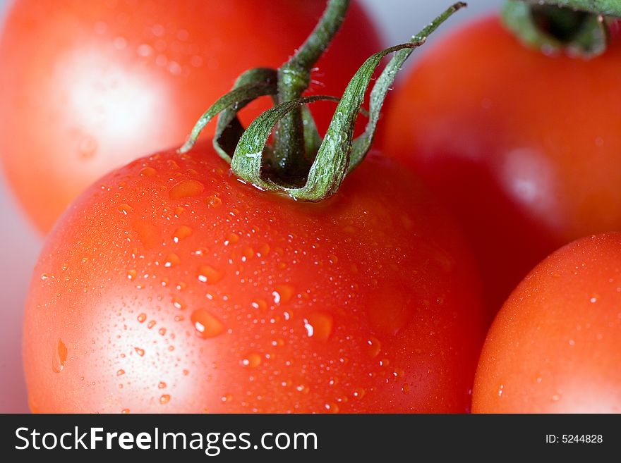 Fresh tomatoes, isolated on white
