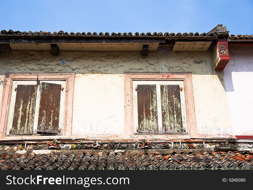 Chinatown architecture with wooden window shutters