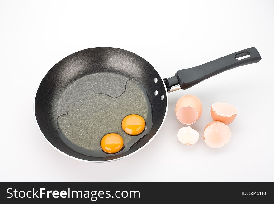 Yolks and broken eggs, isolated