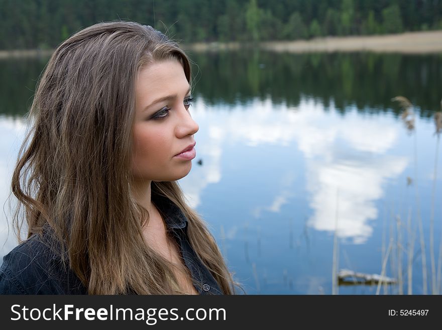 Portrait of young sexual girl on lake background