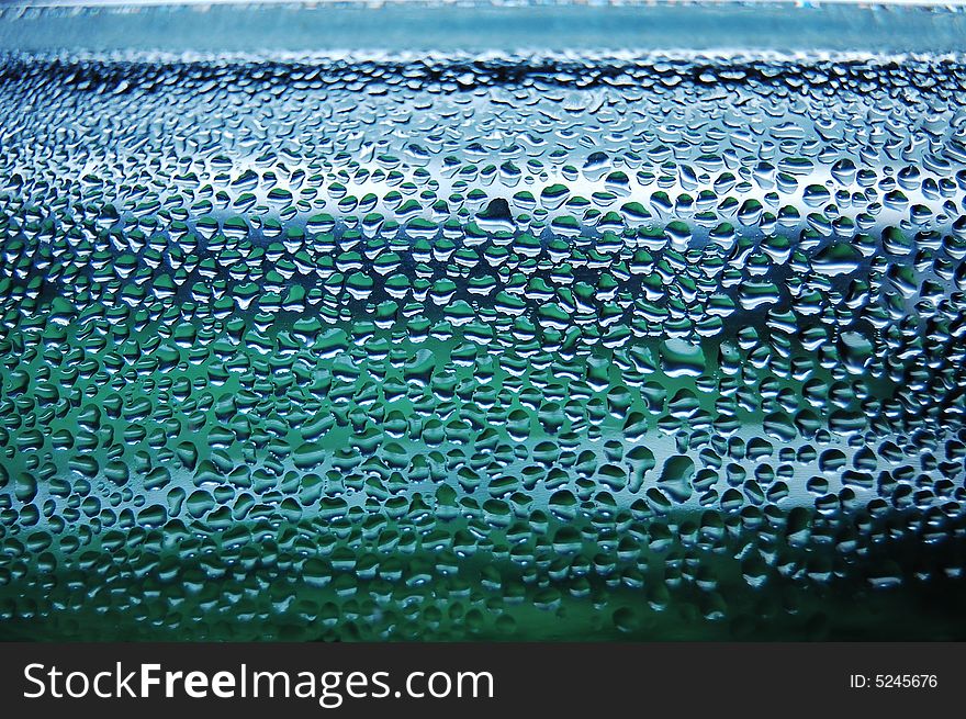 Raindrops creating wonderful aquamarine background. Raindrops creating wonderful aquamarine background