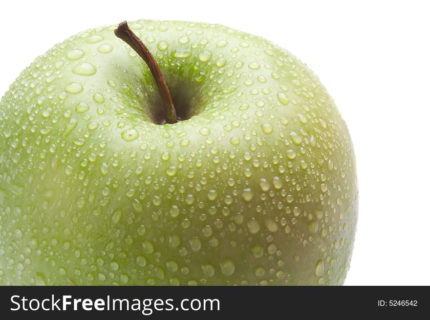 Macro to green apple on water