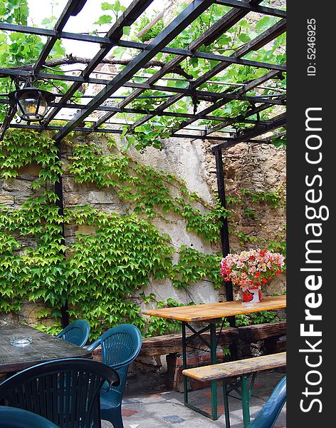 Chairs and tables with flowers in a typical restaurant in countryside