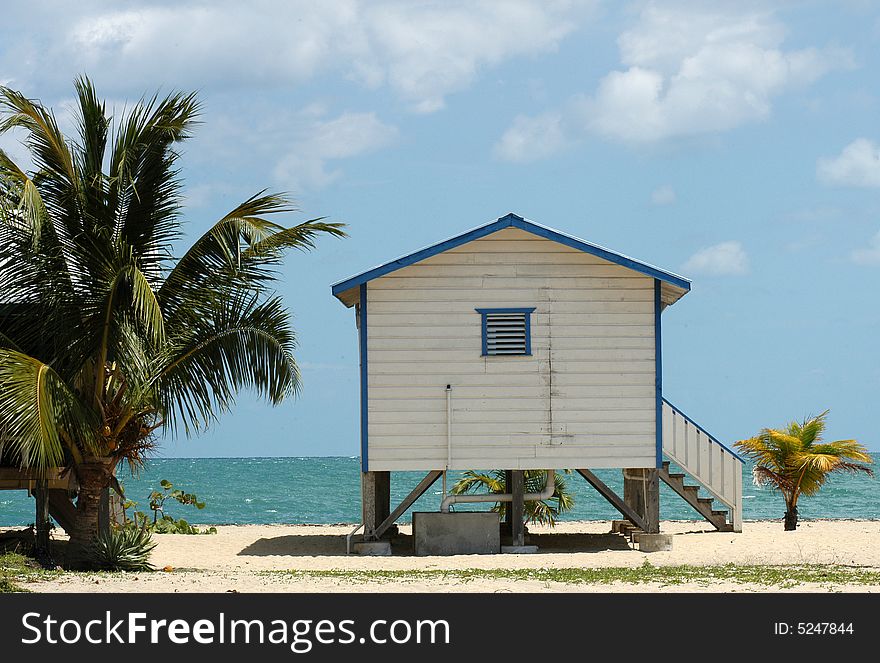 A wooden lodge called cabaÅˆa on a beach in Belize. A wooden lodge called cabaÅˆa on a beach in Belize