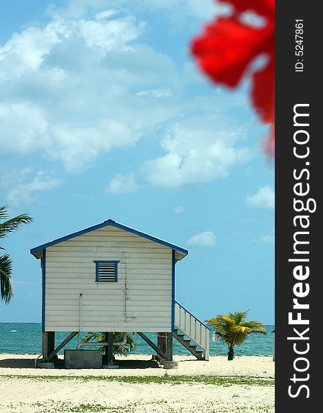 A wooden lodge called cabaÅˆa on a beach in Belize. A wooden lodge called cabaÅˆa on a beach in Belize