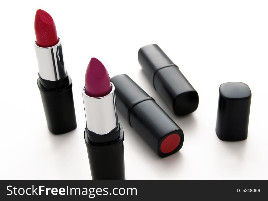 A few lipsticks on white background