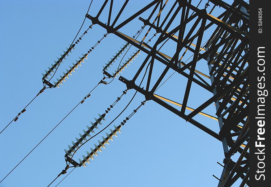 Power transmission line on a background of the blue sky. Power transmission line on a background of the blue sky