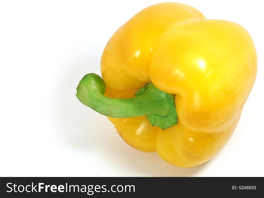 Isolated big nice yellow paprika against white. Isolated big nice yellow paprika against white