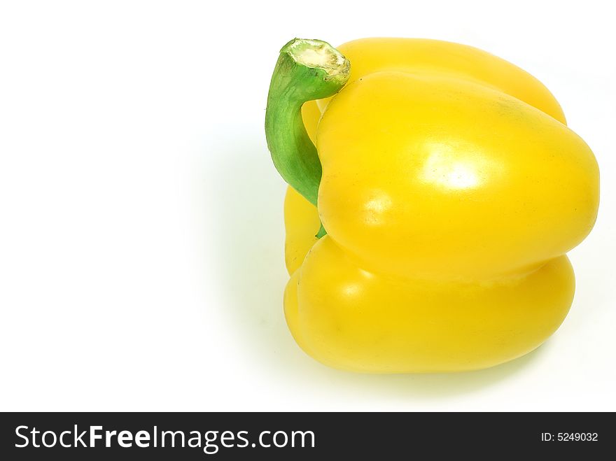 Isolated big nice yellow paprika against white. Isolated big nice yellow paprika against white